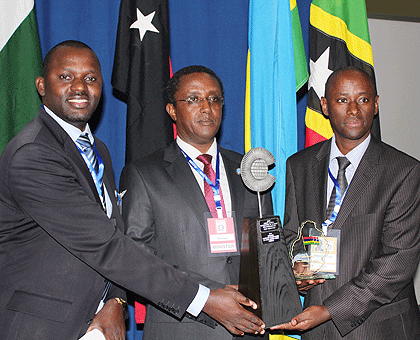 The Minister of Education, Dr Vincent Biruta (C), Emmanuel Muvunyi (R) and Janvier Gasana of Rwanda Education Board received the highly coveted Commonwealth award in Mauritius, yesterday.  The New Times/Courtesy.