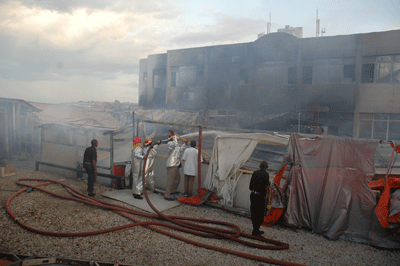 Fire fighters trying to extinguish fire at the former B-Club discotheque. City authorities have issued fresh directives on fire insurance. The New Times / File