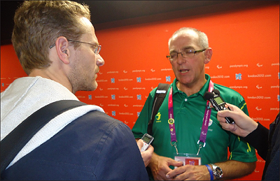 Rwanda's sitting volleyall team head coach Peter Karreman (R) gives an interview after the loss to Brazil on Friday. Sunday  Sport / Pascal Bakomere.