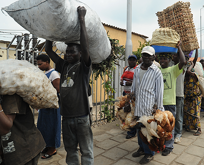 Traders crossing with goods to sell between Rwanda and Rubavu. The Sunday Times / John Mbanda.