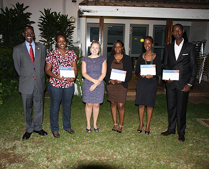 The Four winners of this yearu2019s post graduate Chevening Scholarships, pose for a photo at the Embassy. The Sunday Times / F. Kanyesigye.