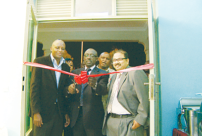 Denis Karera, President of Rwanda Hotels and Restraurants Association (C) launching the Excellence Hotel Supplies Ltd as while Emmanuel Murekezi, Director Operations(L) and Mirza Shakeel Director (R) look on. The New Times / Courtesy.