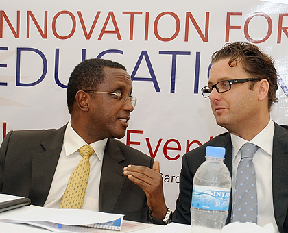 Education Minister Dr. Vincent Biruta (L) with Marc Van der Stouwe, the Fund Manager for Innovation for Education Programme at the launch yesterday. The New Times / John Mbanda.