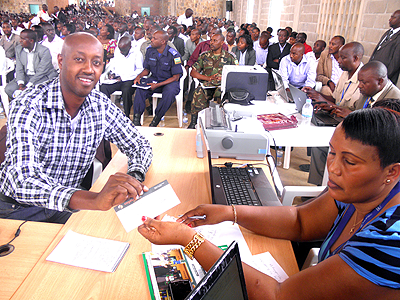 Bank officials were ready to receive the money as it trickled in. The New Times / S. Rwembeho.