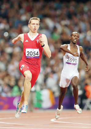 Hermans Muvunyi (R) and Gunther Matzinger of Austria competes in the Men's 400m - T46 Final. Matzinger won the race, while Muvunyi finished 5th. Net photo.