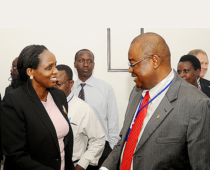 Agriculture Minister Dr. Agnes Kalibata (L) chats with the Executive Director of Forum for Agricultural Research in Africa Prof. Monty P. Jones during a meeting in Kigali yesterday. The New Times / John Mbanda.