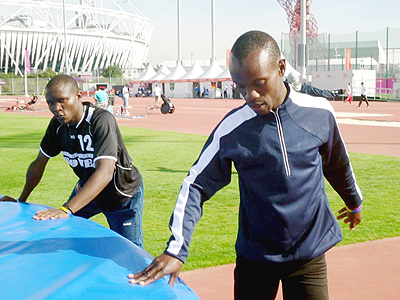 Hermans Muvunyi (R) in training with compatriot Thu00e9onest  Nsengimana on Friday morning. Muvunyi will run in the 800m final tonight. The New Times / Pascal Bakomere.