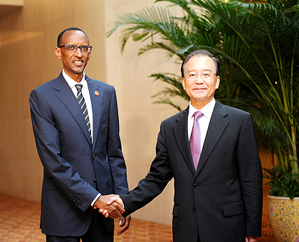 President Paul Kagame with Chinese Prime Minister Wen Jiabao after their meeting on the sidelines of the Summer Davos Forum in Tianjin, China yesterday. The New Times / Village Urugwiro.