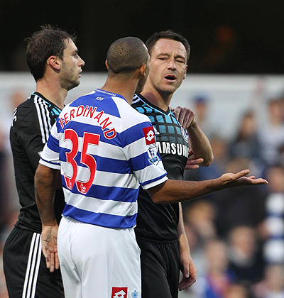 Anton Ferdinand and John Terry clash at Loftus Road last October. Net photo.