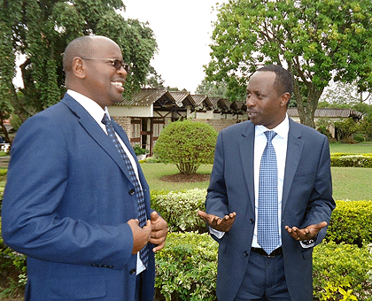 Local Government Minister James Musoni (L) chats with the Governor of Southern Province Alphonse Munyantwari shortly after launching the training. The New Times / JP Bucyensenge.