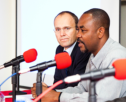 Dr Anicet  Nzabonimpa (R), from the Ministry of Health, and Morten Sorensen of UNFPA at the meeting yesterday. The New Times / Timothy Kisambira.