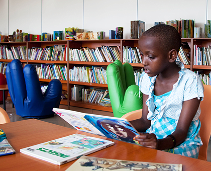 A child reading at Kigali Public Library. A Rwandan publisher has been awarded for promoting the reading culture. The New Times / T Kisambira.