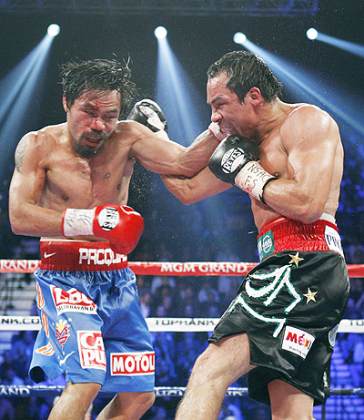 Juan Manuel Marquez (R) of Mexico and Manny Pacquiao of the Philippines (L) have met three times already. Net photo.