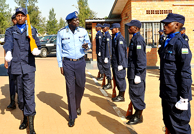 South Sudanu2019s Inspector General of Police Acuil Tito Madut inspects a guard of honour mounted by Rwanda National Police offices yesterday. The New Times / Courtesy.