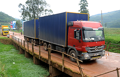 A Burundi bound transit goods truck crosses into Rwanda from Uganda. Regional traders have threatened to sue Kenya over loses. The New Times / John Mbanda.