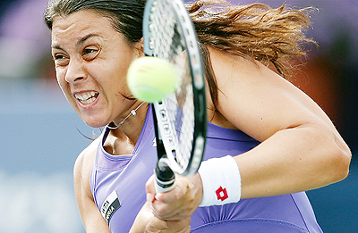 Franceu2019s Marion Bartoli bundled out Japanu2019s Kimiko Date-Krumm 6-1 6-4. Net photo.