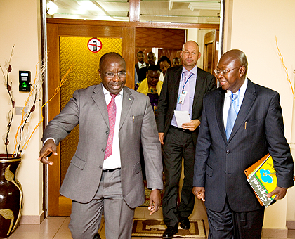 Prime Minister Pierre Damien Habumuremyi (L) leads the new United Nations Resident Coordinator Lamin Manneh from his office yesterday. The New Times / T. Kisambira.