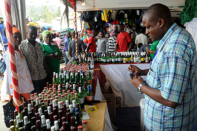 A herbalist cashes in as customers buy  traditional medicine. The New Times / File.