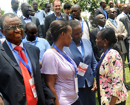 Dr Corine Karema, the Head of Malaria Division at RBC (right), engaging some of the participants at the regional meeting on malaria, yesterday. The New Times / John Mbanda.