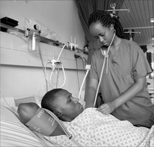 A nurse at Kingfaisal hospital  attending to a patient. Delivery of good services in health care facilities is very necessary.  The Sunday times T. Kisambira