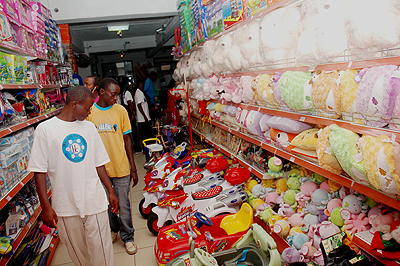 Customers admire goods in a shop. The New Times / File.