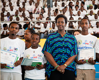 First Lady Jeannette Kagame poses with graduates of Akazi Kanoze yesterday. The New Times / Timothy Kisambira.