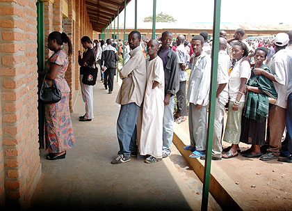 Rwandans queue to cast their votes at a past election. NEC has stressed the importance of next year's elections. The New Times / File.