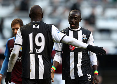 Demba Ba and Papisse Cisse celebrate after scoring. Net photo.