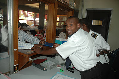 Rwanda Revenue Authority officials collecting taxes at the authorityu2019s offices in Kimihurura.  The New Times. File