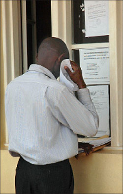 A man seeks services at a local government office. The intensive training of local government personnel will improve services.  The New Times / File.