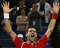 Djokovic celebrates after beating Murray in three spectacular sets. Net photo.