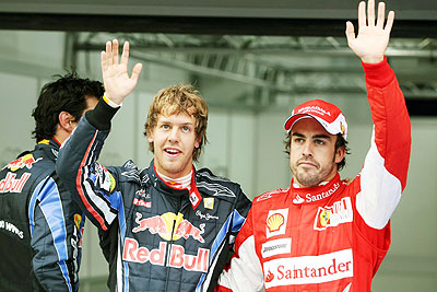 Sebastian Vettel (left) and Fernando Alonso (right) will be teammates ar Ferrari in 2014. Net photo.