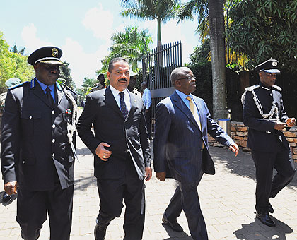 (L-R) Police chief Emmanuel Gasana, Interpol Secretary General Ronald Noble, Ugandan Premier Amama Mbabazi and Gen Kale Kayihura of Uganda Police arriving at the Summit.