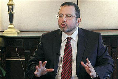 Egypts Prime Minister Hisham Kandil talks during an interview with journalists in Cairo. Net photo