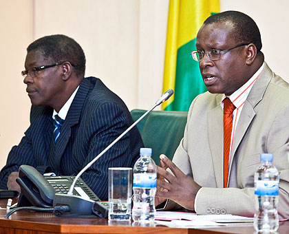 Senator Jean Damascene Bizimana (R), Chairperson of the Parliamentary Forum, together with his deputy Denis Polisi at the news briefing. The New Times / Timothy Kisambira.