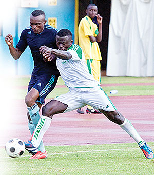 Jacques Tuyisenge (L) beats off a challenge by SC Kiyovu's Fiston Nyarugeta yesterday at Amahoro National stadium.  The New Times, T. Kisambira.