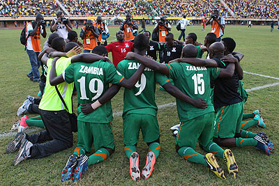 Defending champions Zambia celebrate after beating Uganda to qualify for the 2013 edition. Net photo.