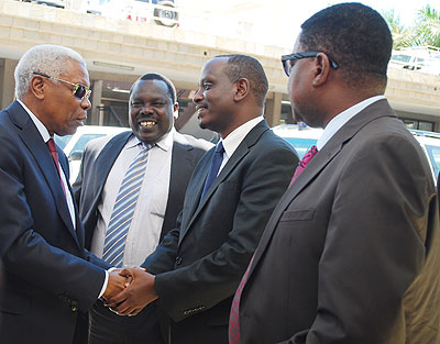 EAC Secretary General Dr Richard Sezibera welcomes Tanzanian Vice President Mohammed Gharib Bilal as Kenyau2019s EAC Affairs Minister Musa Sirma looks on. The New Times / G Muramira.