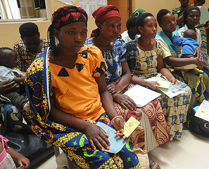 Women line up at a health facility. Initiatives like mutuelle de sante have ensured that more women seek services at health facilities. The New Times / File.