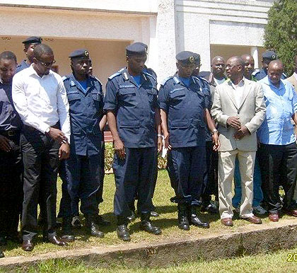 Police officers, including those who attended the training, pose in a group photo with NUR officials shortly after receiving the certificates.The New Times / T. Kisambira.