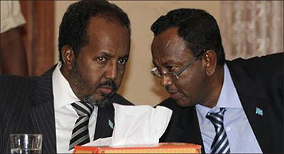 President of Somalia Hassan Sheikh Mohamud (L) and Prime Minister Abdi Farah Shirdon Saaid confer during the appointment of Somalias cabinet at the presidential palace in Mogadishu November. Net photo.