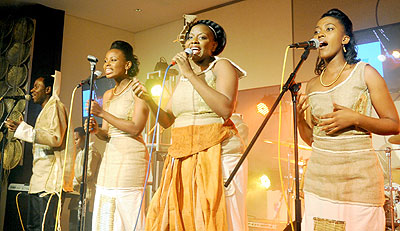 Tonzi (C) and her back-up vocalists take to the stage.