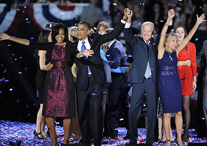 U.S. President Barack Obama (R Front) and Vice President Joe Biden (L Front) attend the election night rally in Chicago, the United States, on Nov. 7, 2012. Xinhua.