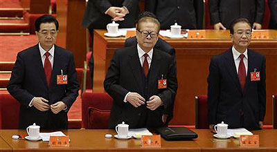 Chinas President Hu Jintao, former President Jiang Zemin and Premier Wen Jiabao stand at the beginning of the opening ceremony of the 18th National Congress of the Communist Party of China.