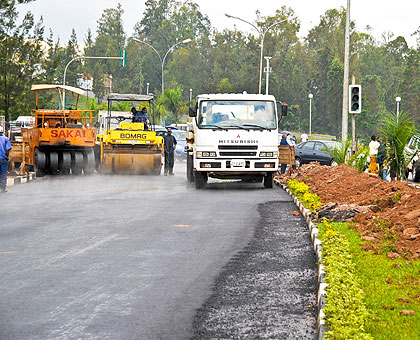 Construction works on the Airport Road in the past.  Government has secured concessional loans to construct more roads. The New Times / File.