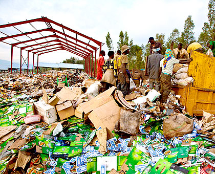 Trucks offloading at the new dumping site in Nduba, Gasabo district. The New Times / Timothy Kisambira.