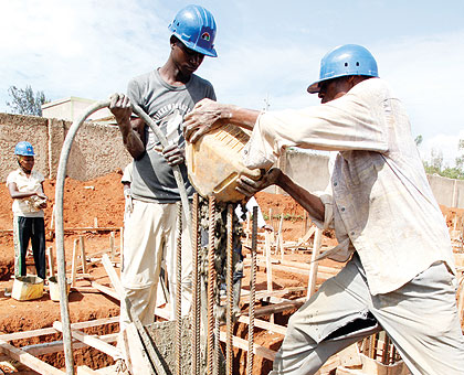 Workers at a construction site in Kigali. The New Times / T.Kisambira.