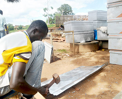 An artisan making a metallic case at Gakinjiro market. The Hang'Umurimo drive has been instrumental in boosting job creation. The New Times / File.