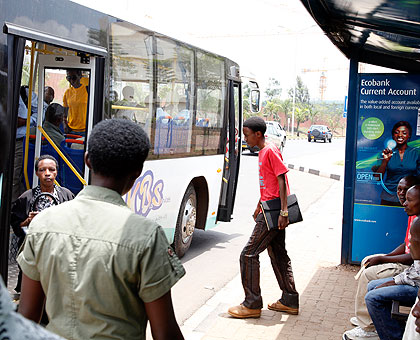 A passenger entering an Onmibus in Kigali. The new regulation by the transport federation had been seen as harsh by vehicle owners. The New Times / File.