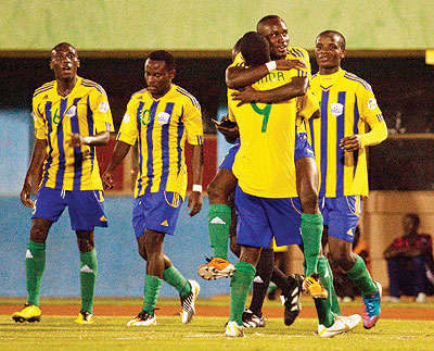  Striker Elias Uzamukuda (back to camera) celebrates with team mates after putting Amavubi 2-0 up on Wednesday before Namibia hit back to draw 2-2. The New Times/T. Kisambira.